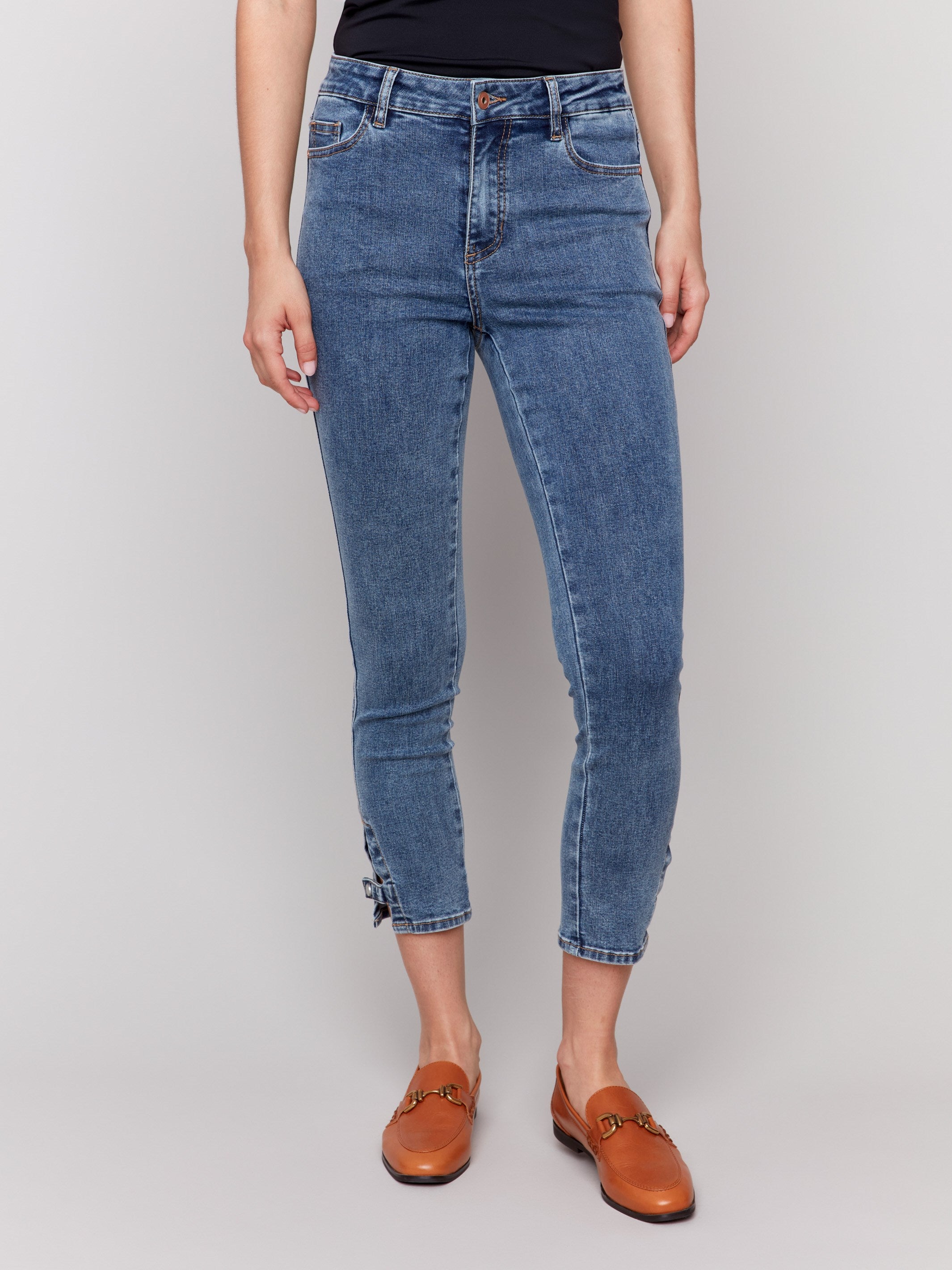 Trendy medium blue jeans with a five-pocket design for added convenience by Charlie B.