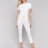 White twill pants with cropped length, featuring a five-pocket design by Charlie B.