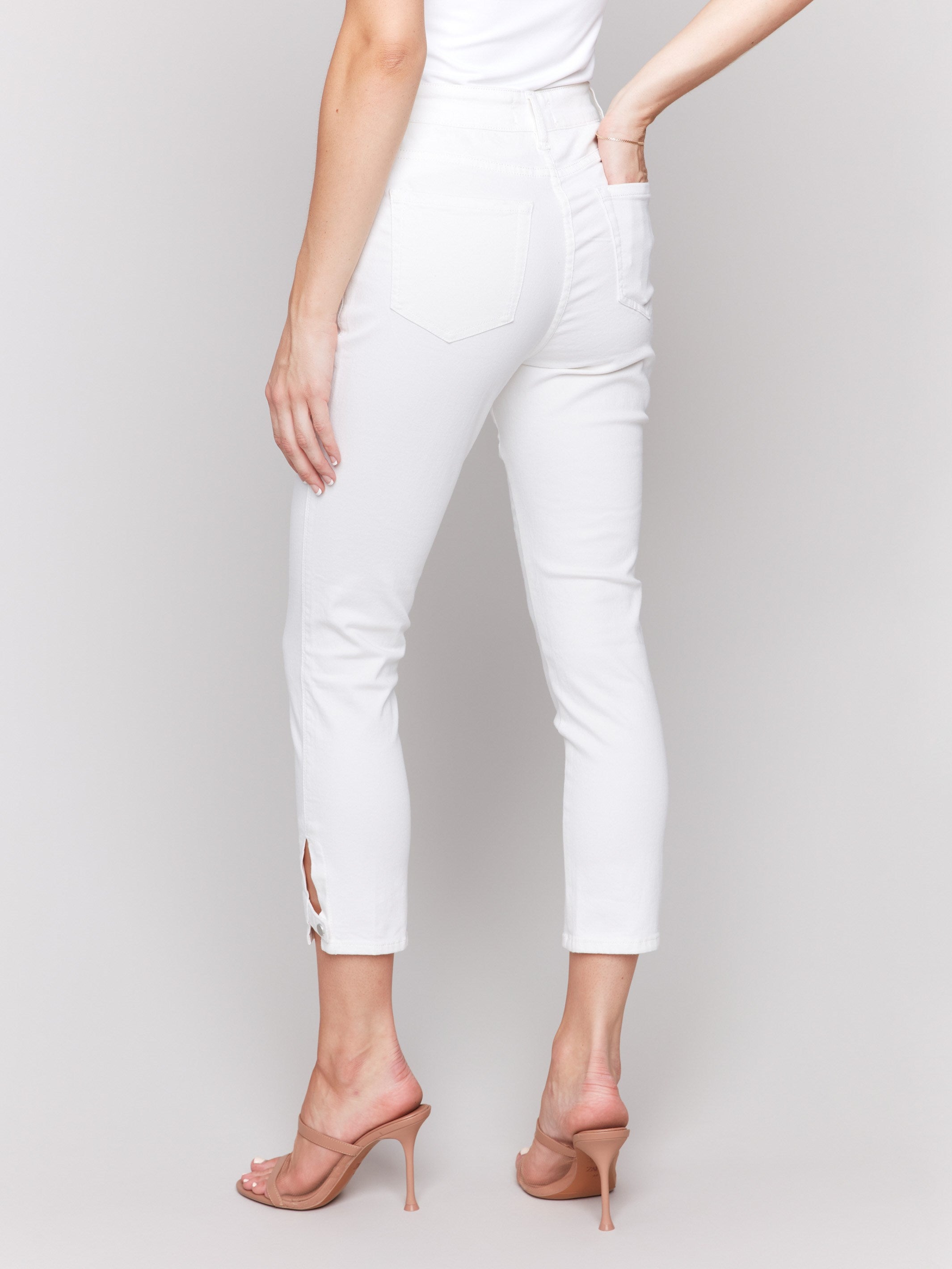 Cropped slim leg pants with regular rise and sleek side mini tabs by Charlie B.