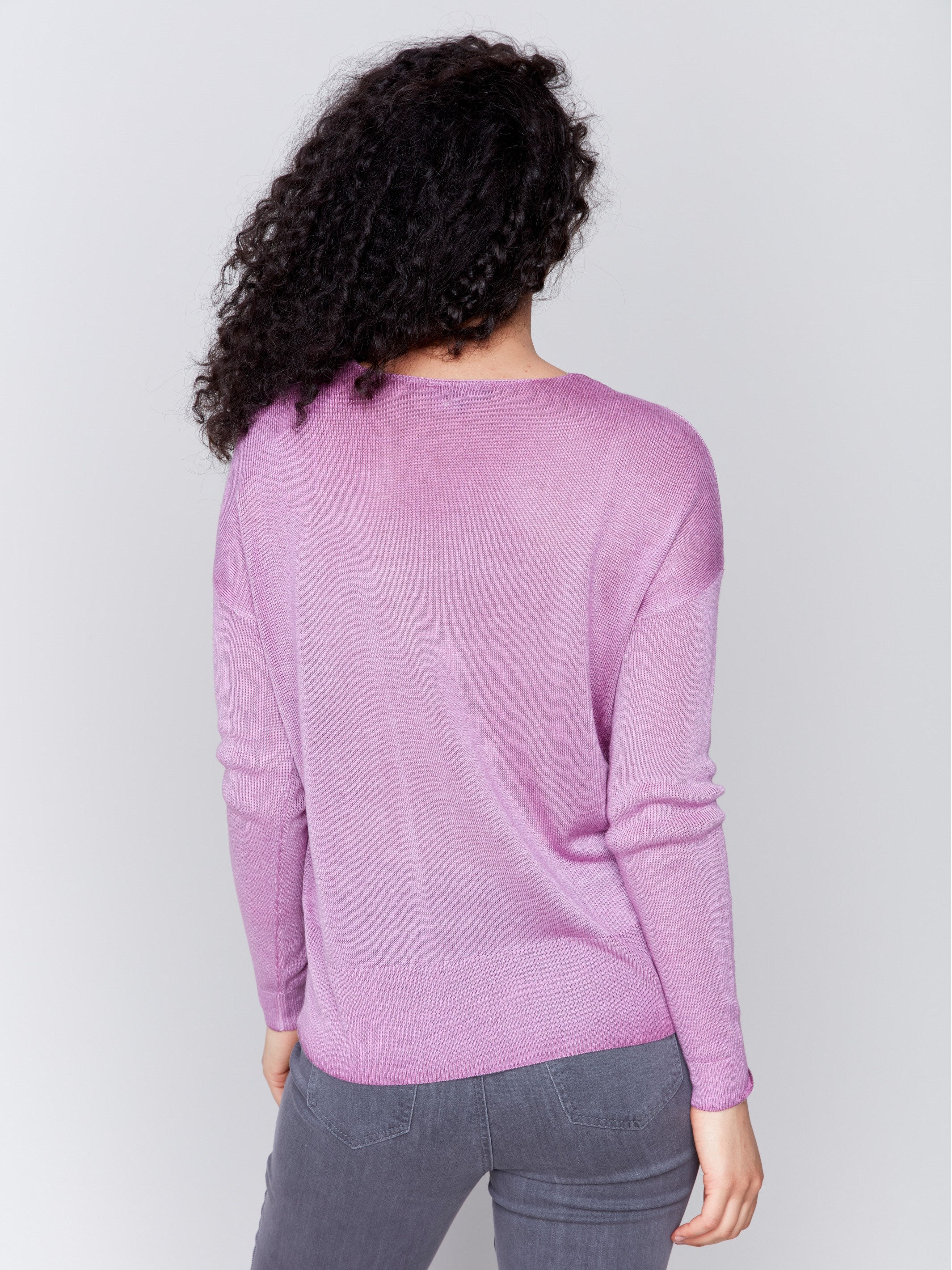 Mulberry purple V-neck sweater with long sleeves, showcasing a relaxed fit and snow wash texture by Charlie B.