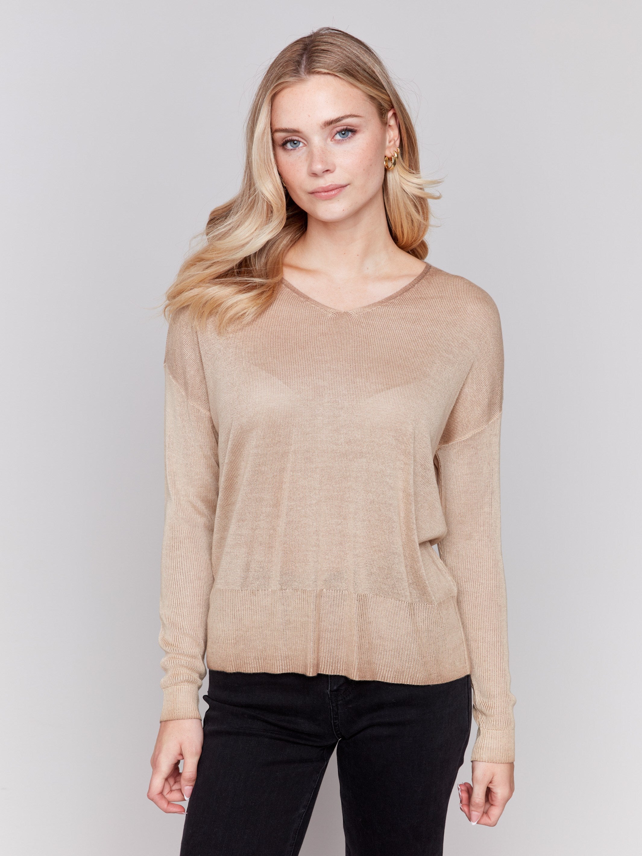 Truffle brown V-neck sweater with long sleeves, showcasing a relaxed fit and snow wash texture by Charlie B.