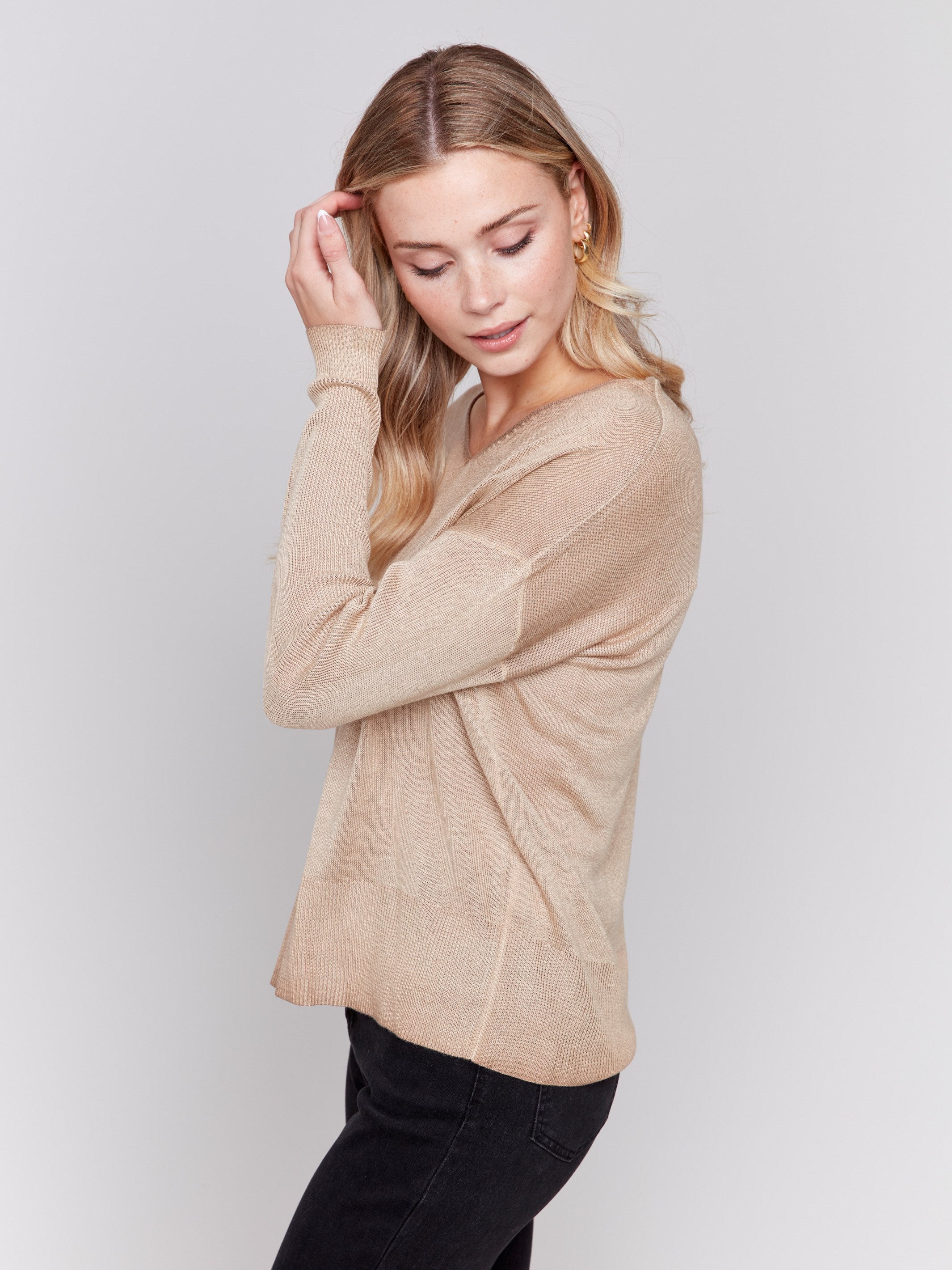 Truffle brown V-neck sweater with long sleeves, showcasing a relaxed fit and snow wash texture by Charlie B.