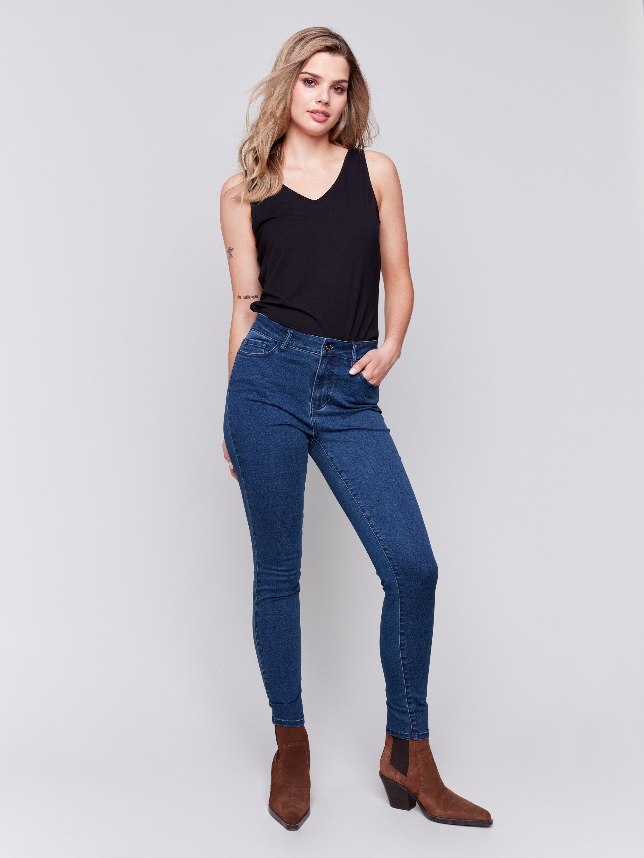 Blue black skinny jeans featuring a five-pocket design and a regular rise by Charlie B.