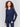 Navy blue V-neck sweater with long sleeves featuring side slits, made from plushy yarn by Charlie B.