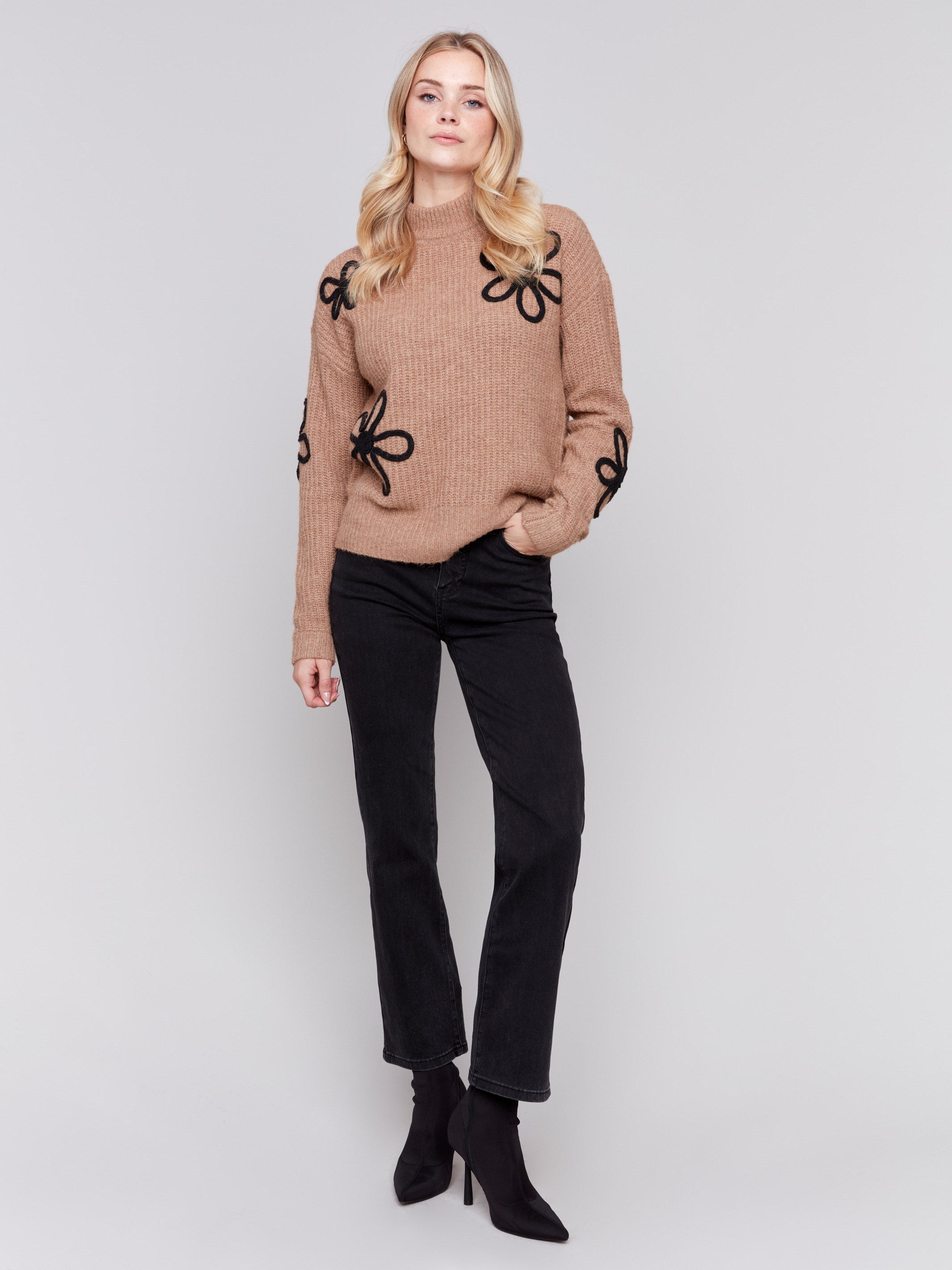 Truffle brown mock-neck sweater with black floral embroidery and ribbed texture by Charlie B.