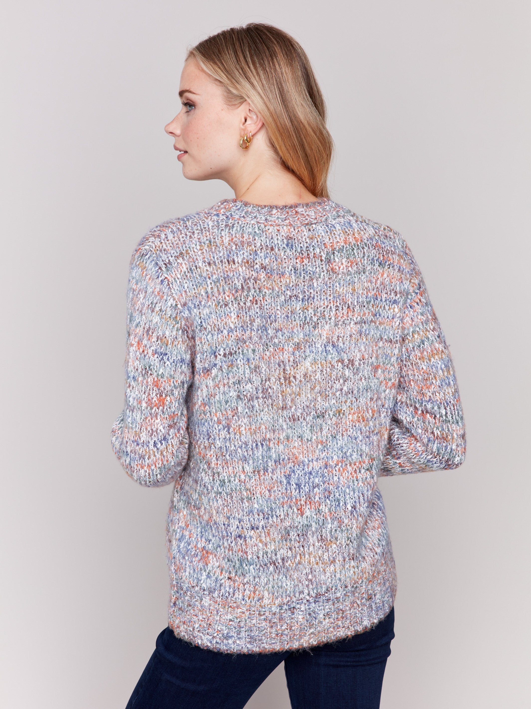 Multicolored space dye knit sweater with long sleeves and a crew neckline by Charlie B.