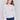 Speckled yarn cable knit sweater with a notched neckline and long sleeves in Ecru white by Charlie B.