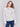 Speckled yarn cable knit sweater with a notched neckline and long sleeves in Ecru white by Charlie B.