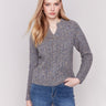 Speckled heather charcoal cable knit sweater by Charlie B with a notched neckline and long sleeves.