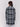 Straight-cut black & white plaid bouclé knit coat with button front closure and patch pockets by Charlie B.