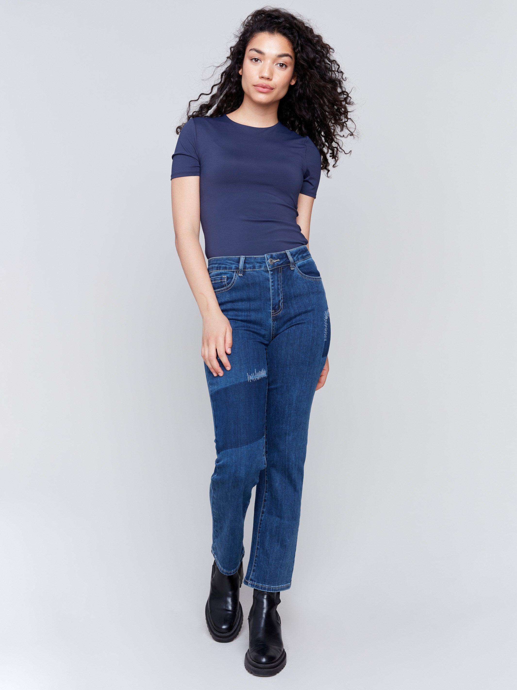 Indigo blue straight-leg jeans with patchwork design featuring front and back pockets by Charlie B.