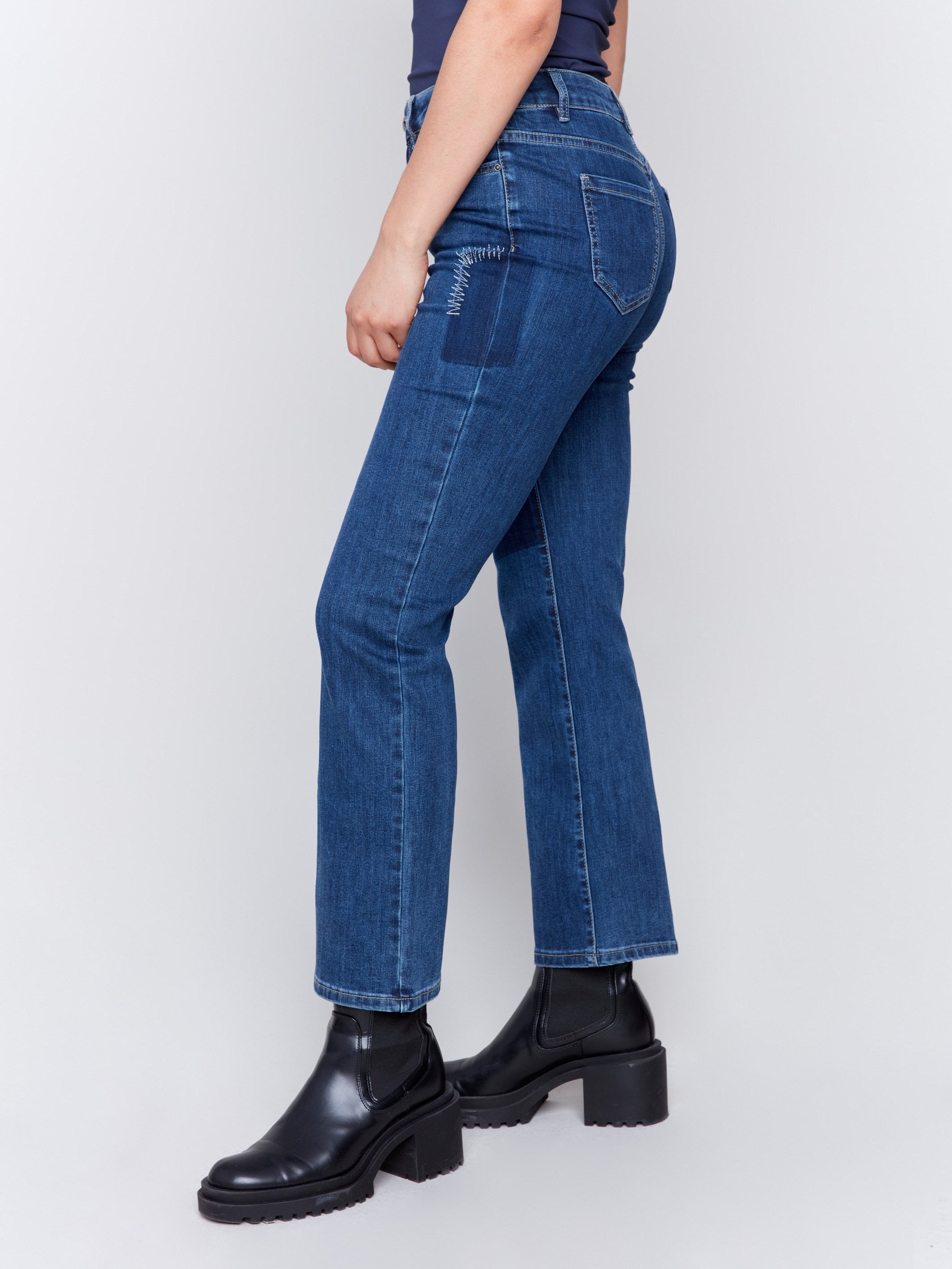 Indigo blue straight-leg jeans with patchwork design featuring front and back pockets by Charlie B.