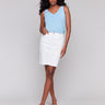 White denim skort with a slim fit, ideal for stylish comfort by Charlie B.