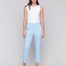 Light blue cropped pants with cuffed hem and slash pockets by Charlie B.