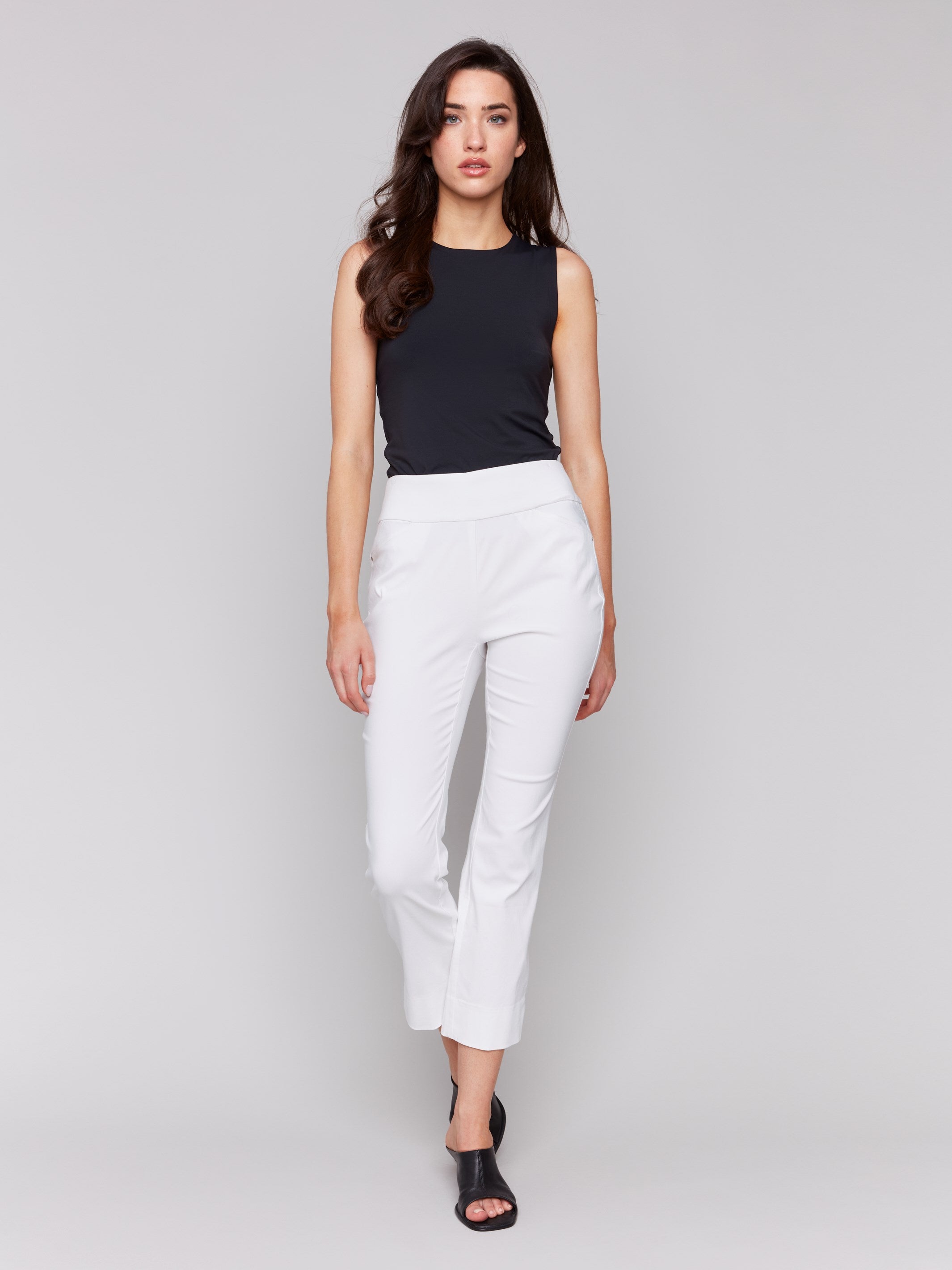 White pull-on capri pants with a stylish slim leg design by Charlie B.