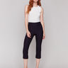 Black capri pants with a slim leg silhouette and stretch fabric by Charlie B.