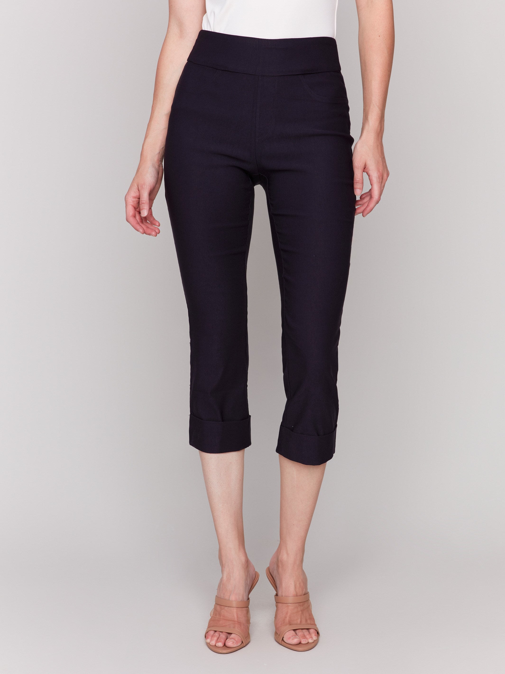 Chic black capri pants featuring a stylish folded cuff design by Charlie B.