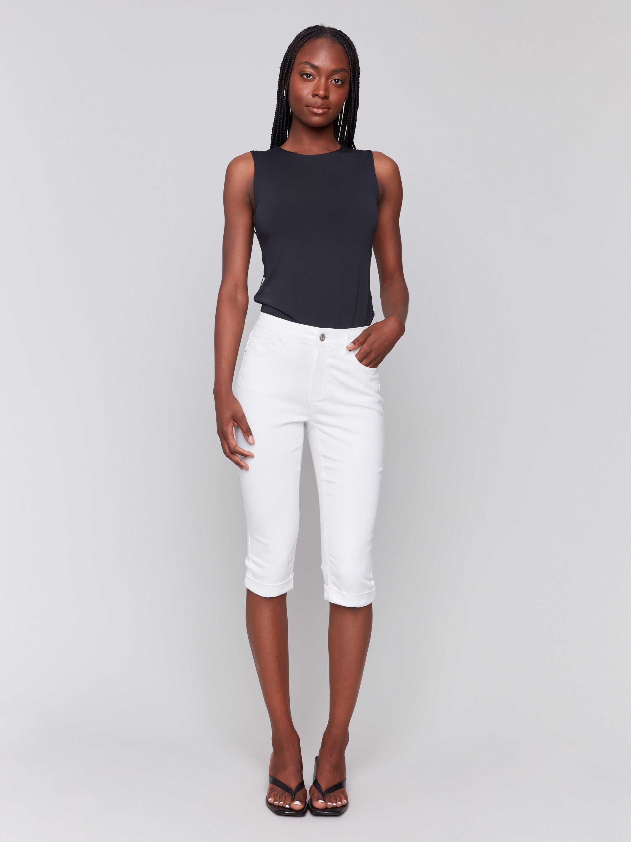 White pedal pusher pants with a cropped length and stretch twill fabric by Charlie B.