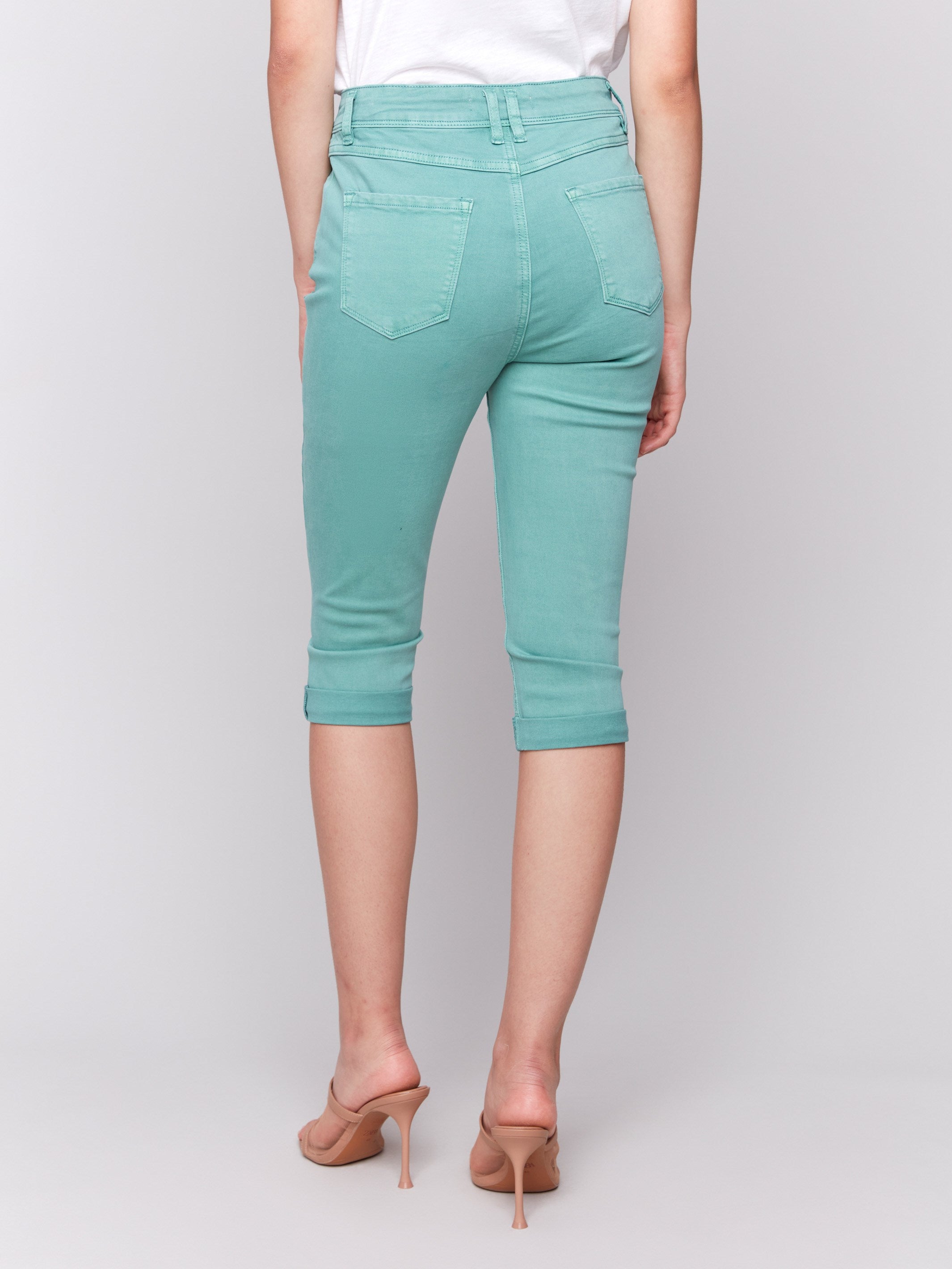 Slim fit green pants with versatile five-pocket design, by Charlie B.