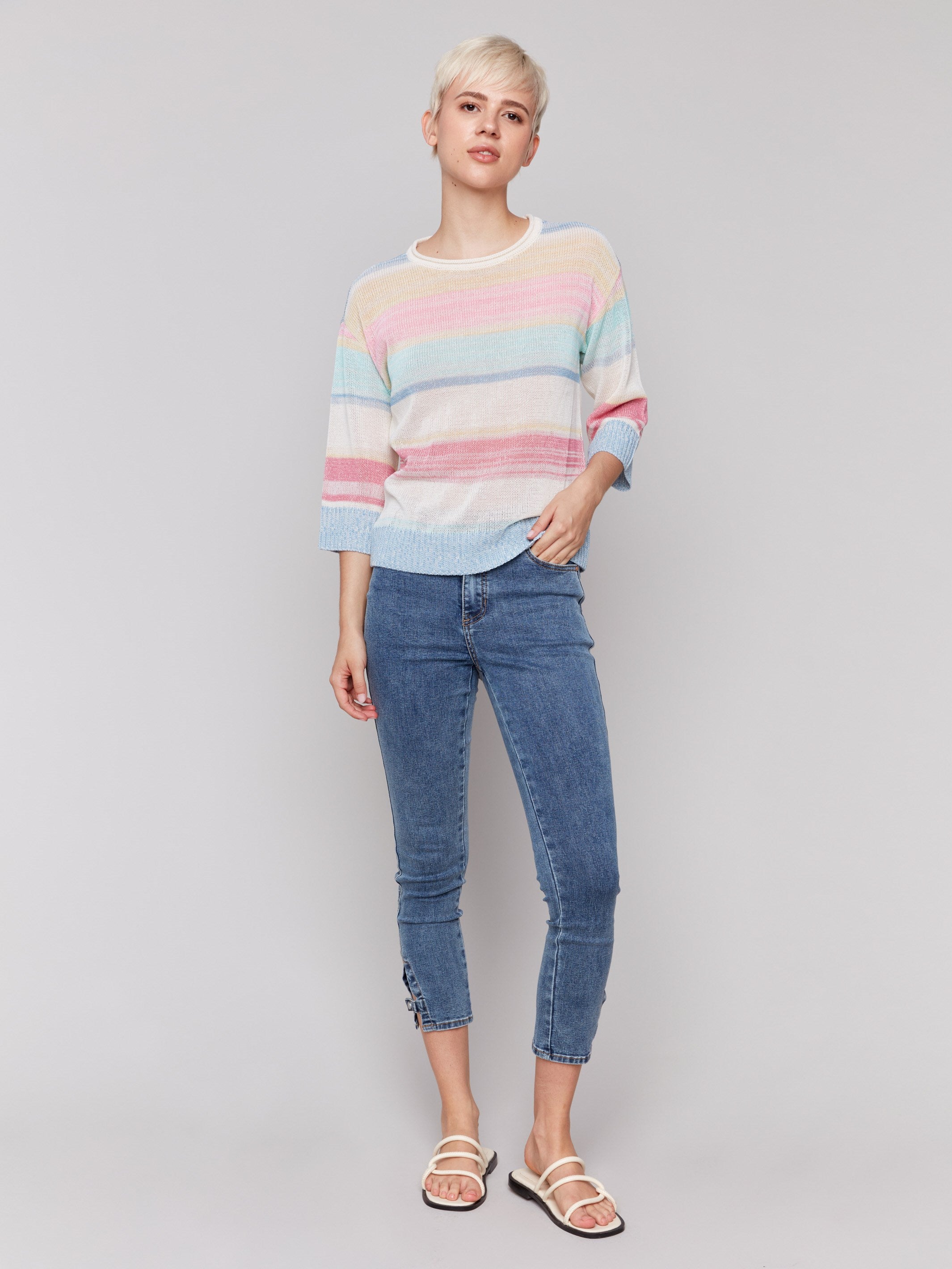 Elegant sweater showcasing a pastel stripe pattern by Charlie B.