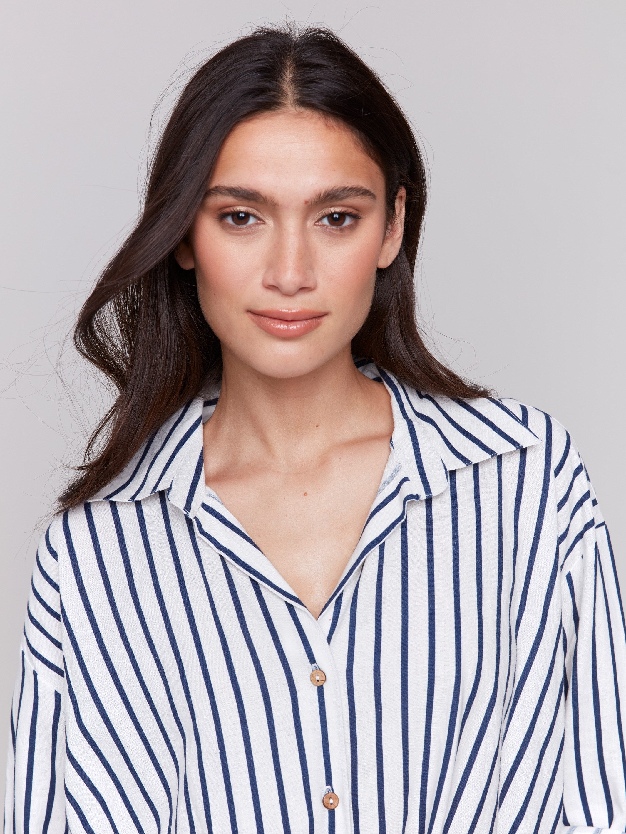 Shirt featuring a striped pattern and classic collar by Charlie B.