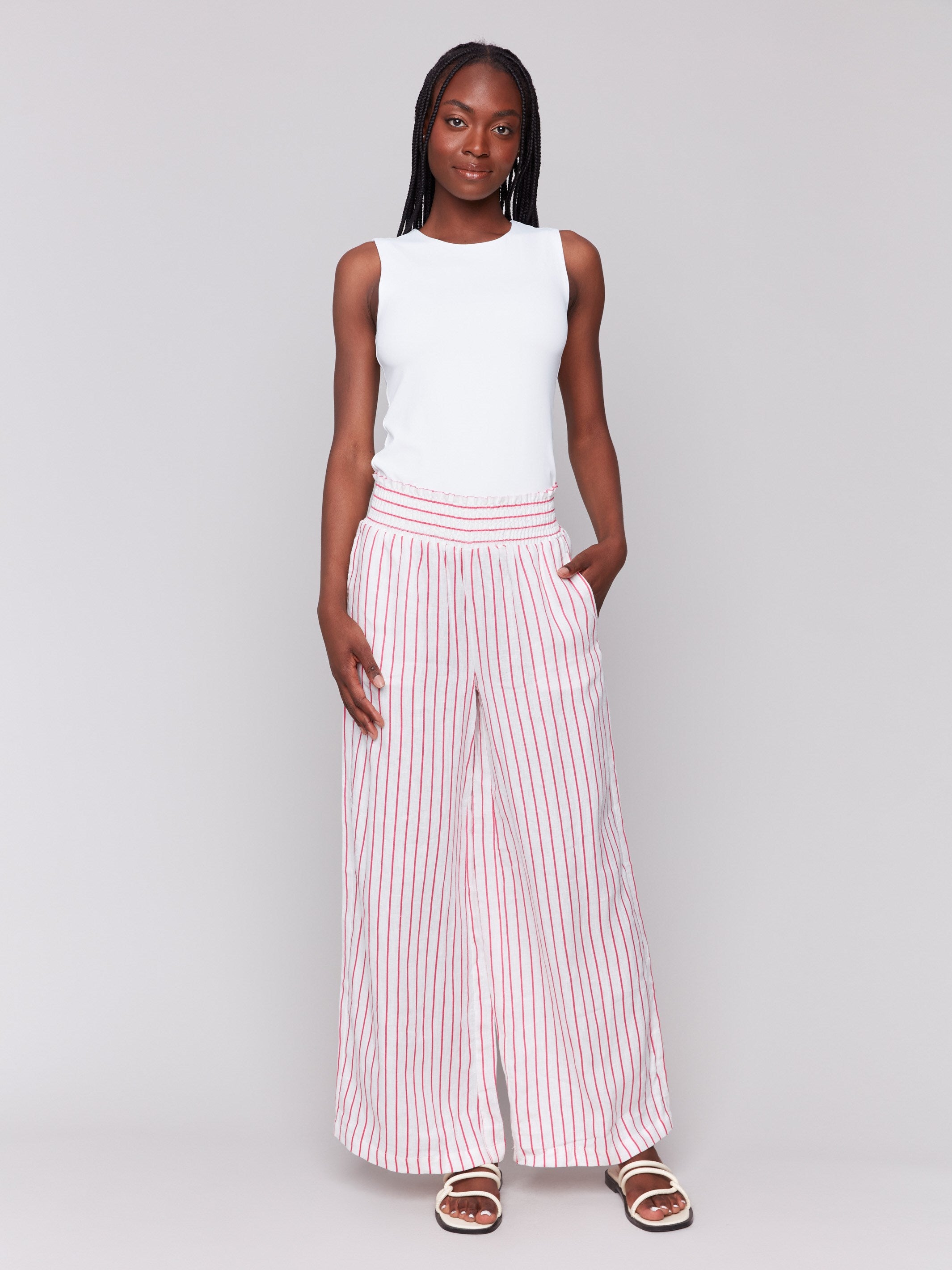 Women's pants with a smocked waistband and pink stripes by Charlie B.