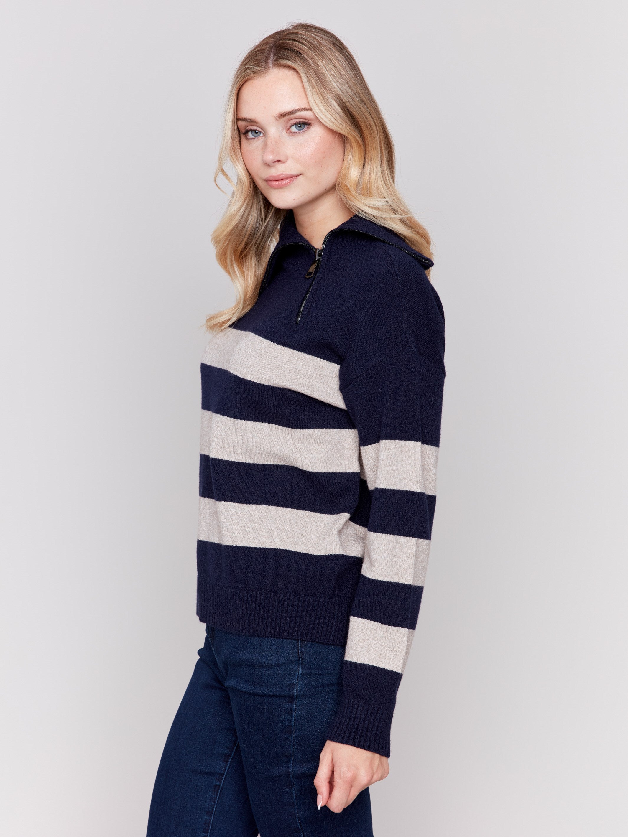 Navy and beige striped turtleneck sweater with a zipper detail and ribbed trim by Charlie B.