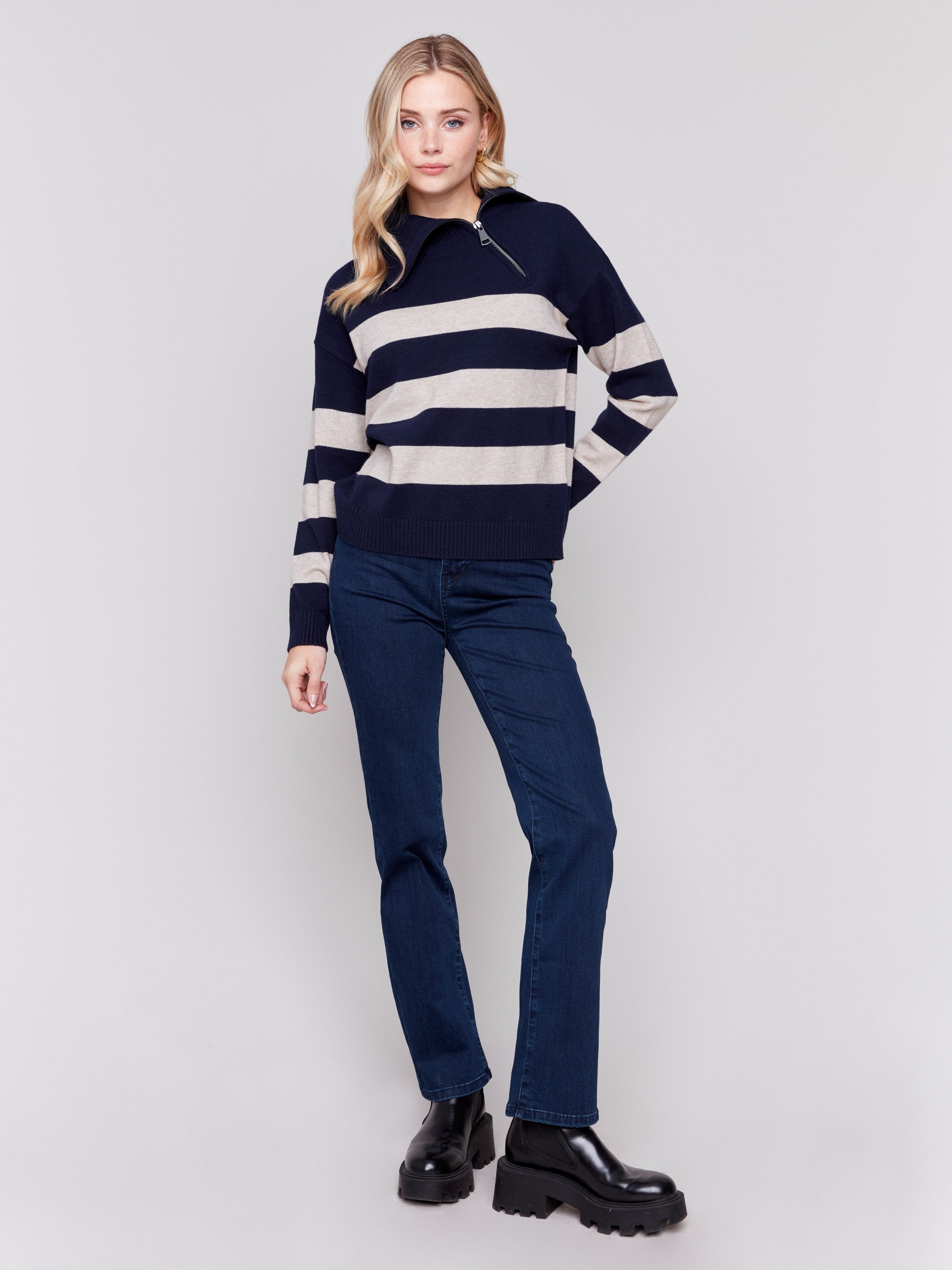 Navy and beige striped turtleneck sweater with a zipper detail and ribbed trim by Charlie B.