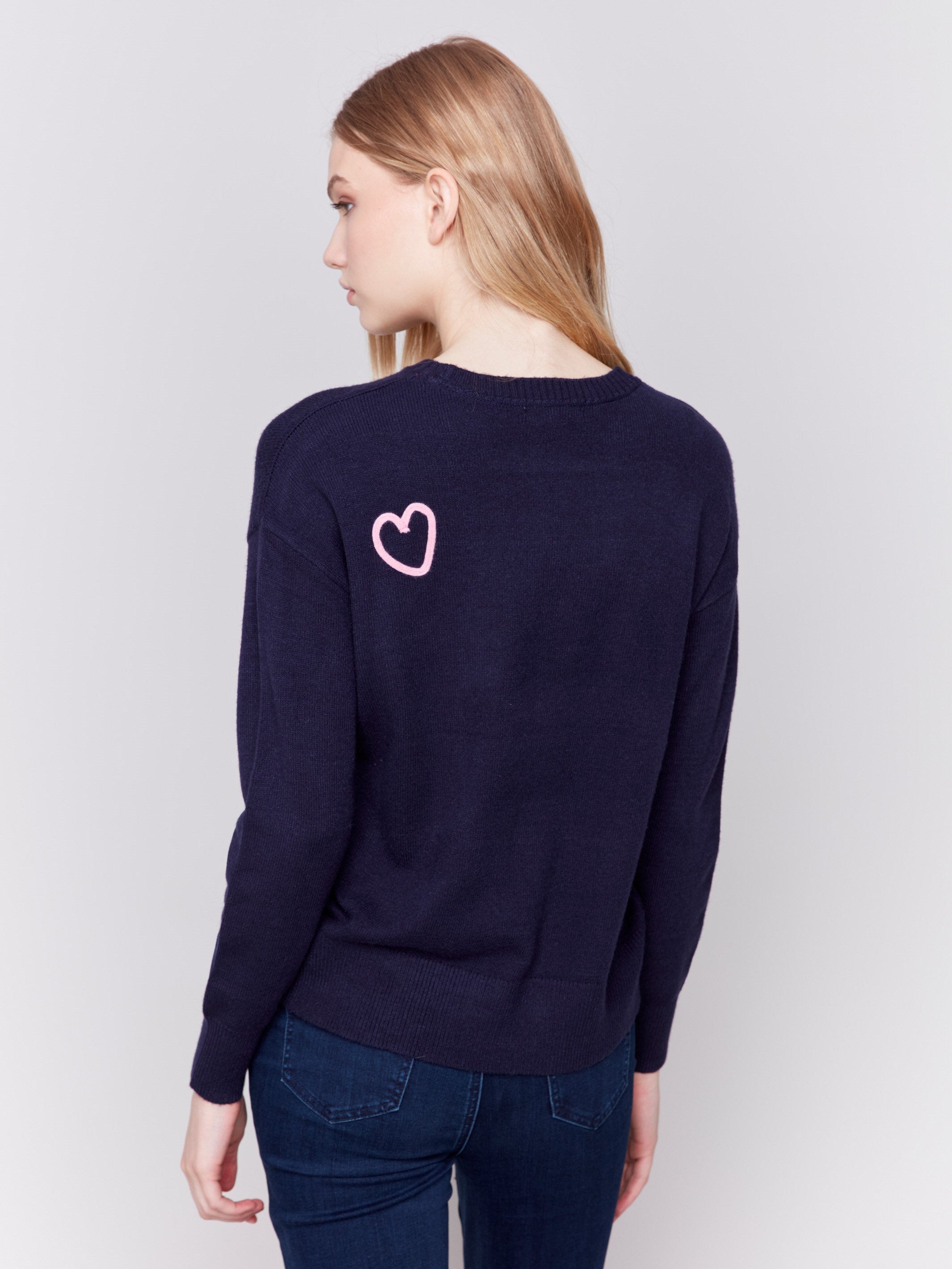 Navy blue sweater adorned with mini heart embroidery, featuring a crew neck and long sleeves by Charlie B.