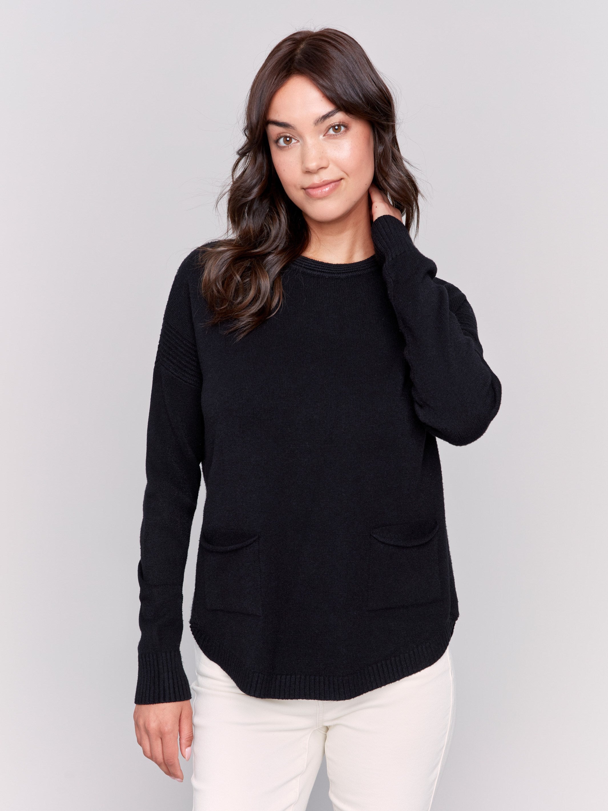 Black round hem sweater with a removable scarf and front pockets by Charlie B.