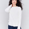 Ecru white sweater with long sleeves featuring side tab details and a round hem by Charlie B.