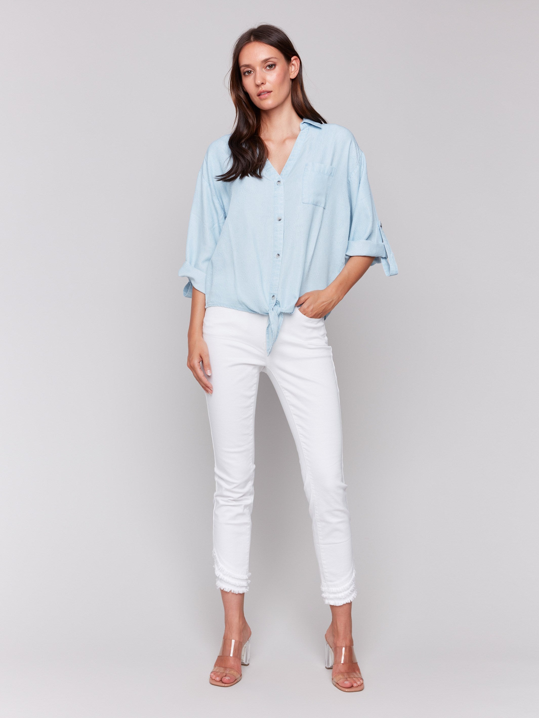 Fashionable light blue blouse with a practical chest pocket by Charlie B.