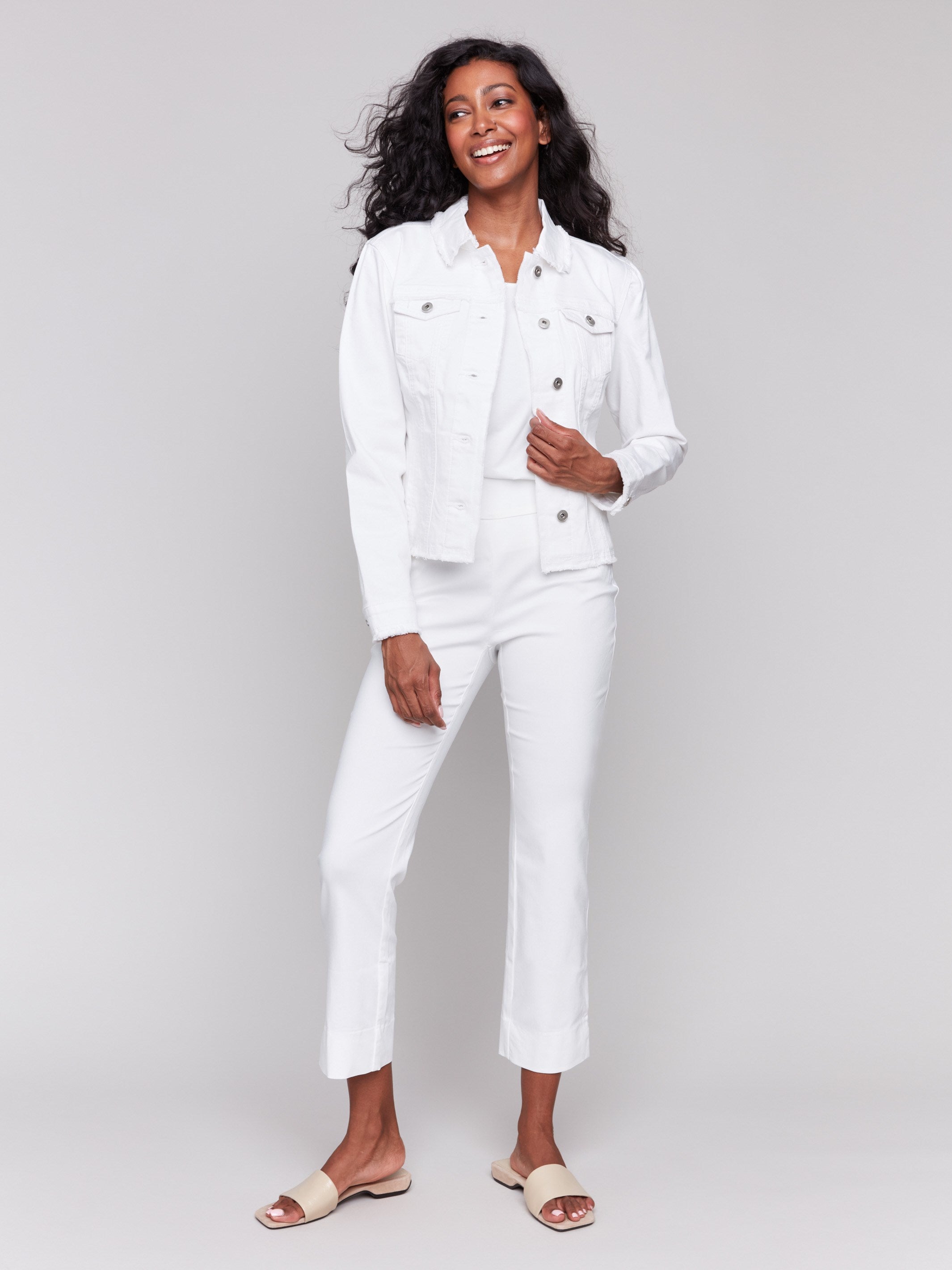 White twill jean jacket with frayed edges and front pockets by Charlie B.