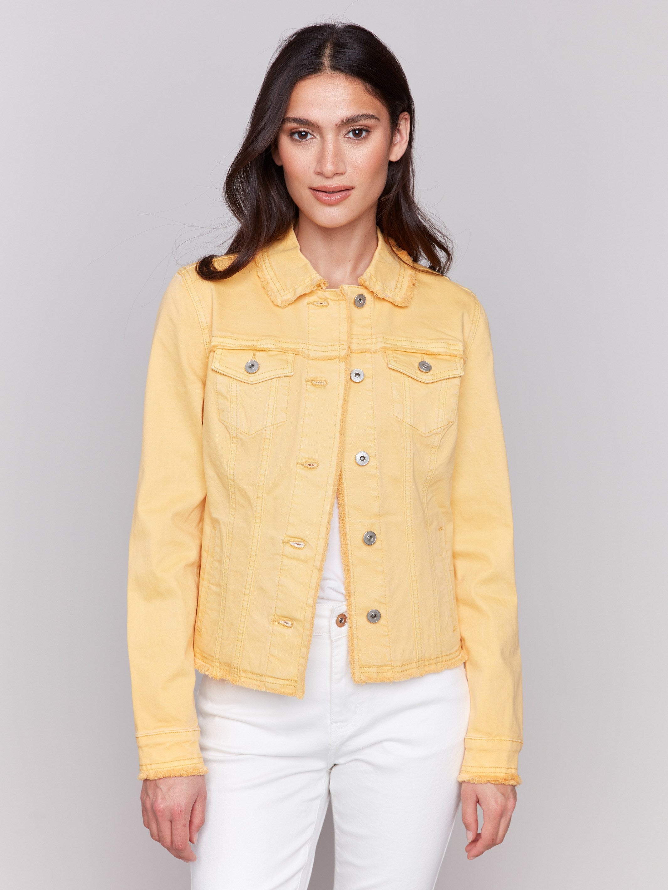 Lemon yellow twill jean jacket with frayed edges and front pockets by Charlie B.