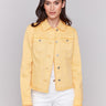 Lemon yellow twill jean jacket with frayed edges and front pockets by Charlie B.