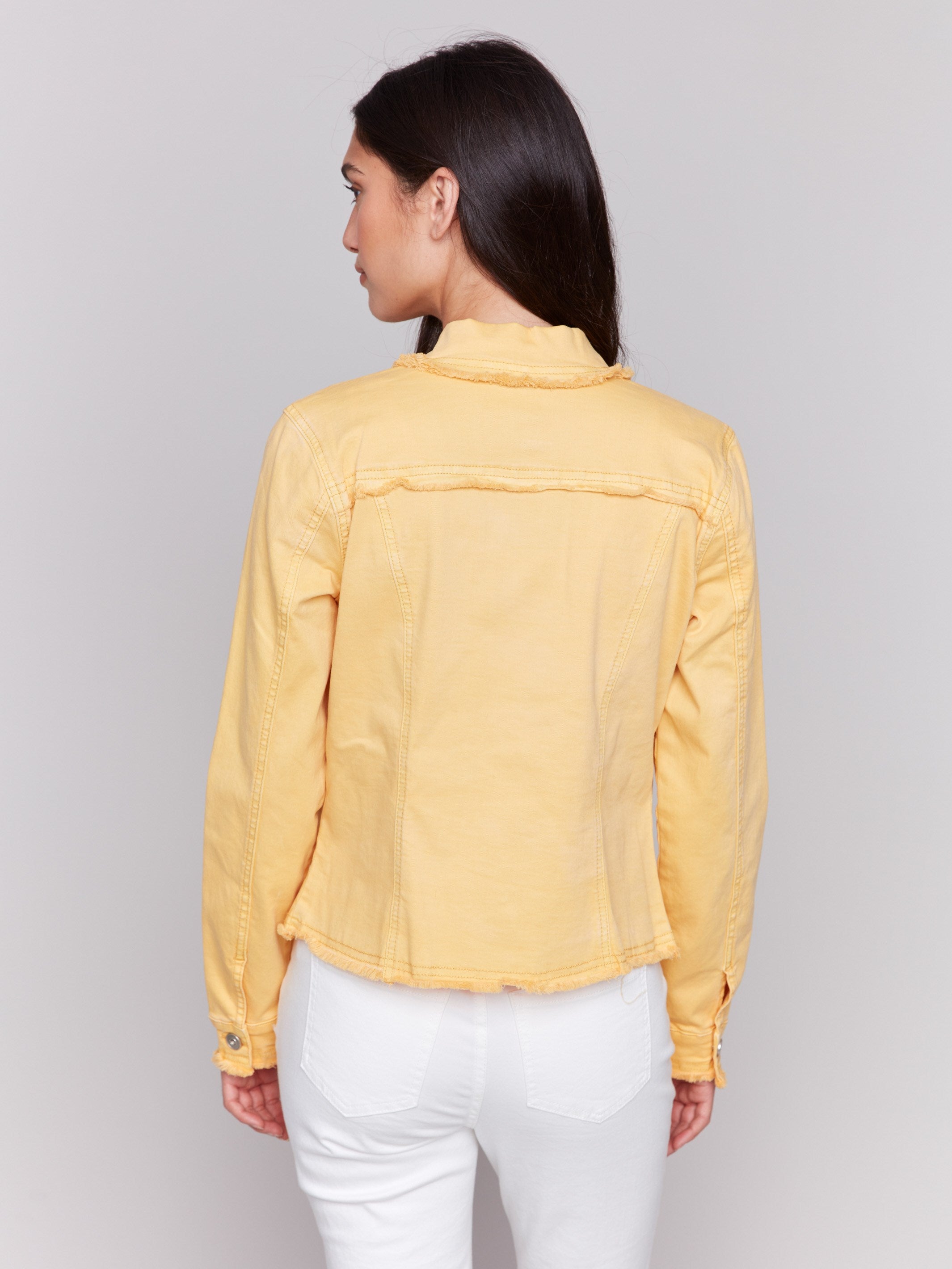 Lemon yellow twill jean jacket with frayed edges and front pockets by Charlie B.