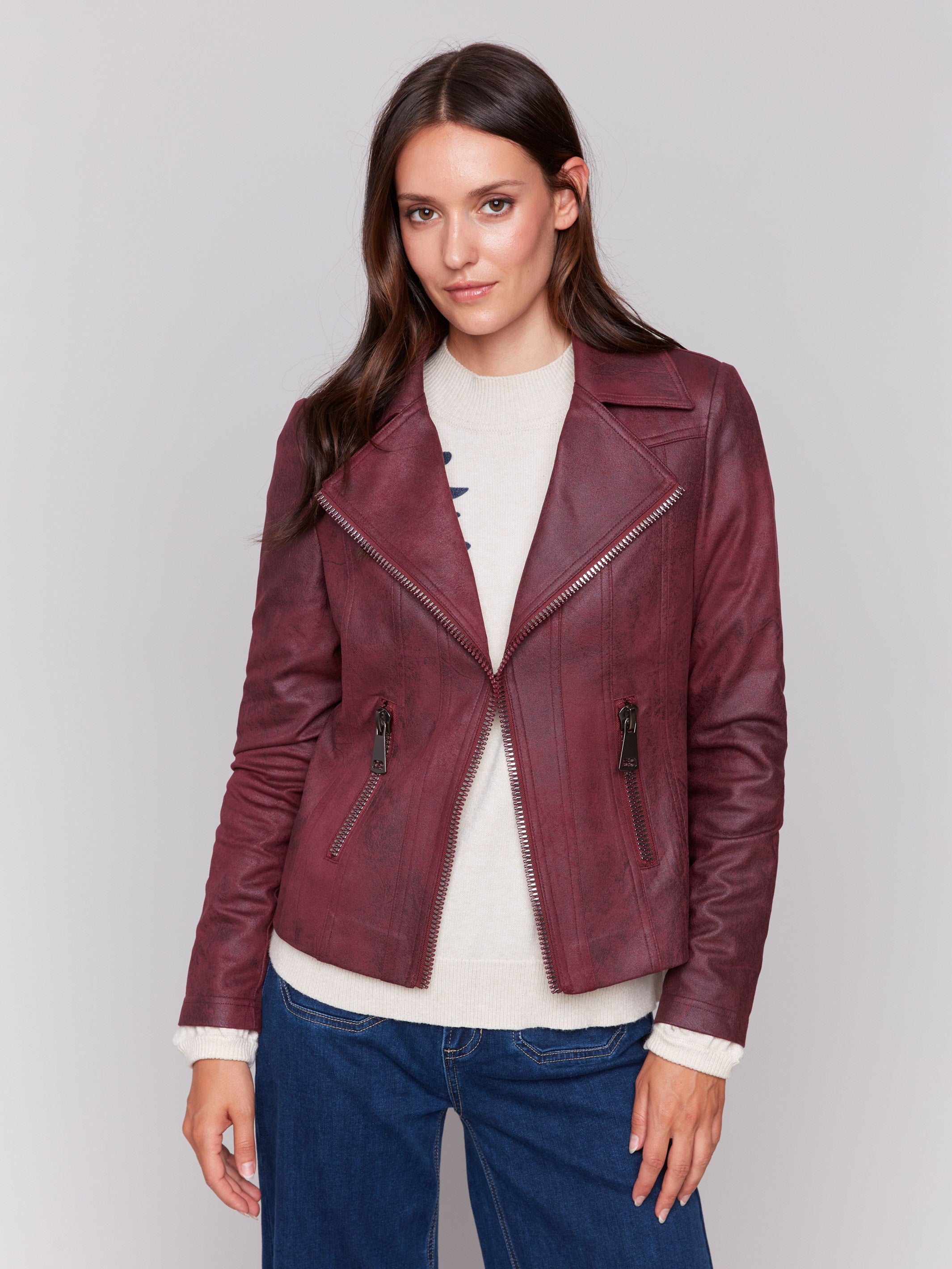 Cabernet red faux leather biker jacket with zipper details and fake pockets by Charlie B.