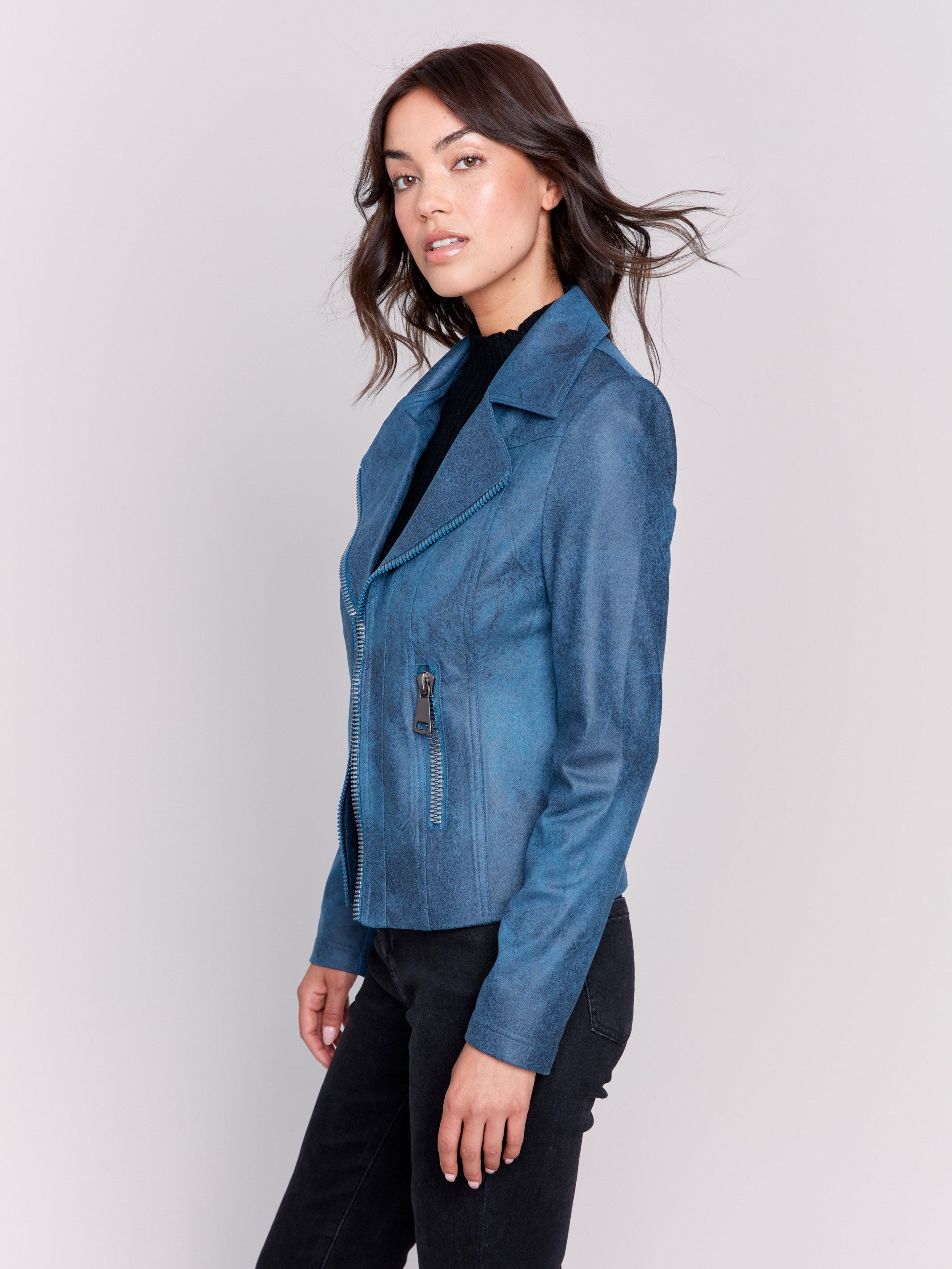 Peacock blue faux leather biker jacket with zipper details and fake pockets by Charlie B.